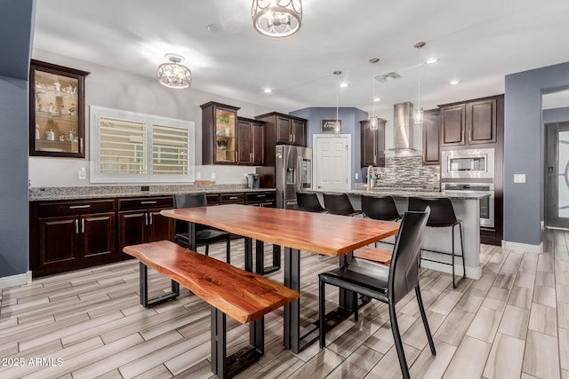 10738 W Rowel Rd, Peoria, AZ 85383 - dining space with wood finish floors, baseboards, a chandelier, and recessed lighting