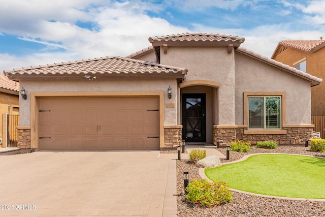 10738 W Rowel Rd, Peoria, AZ 85383 - mediterranean / spanish house featuring stone siding, driveway, a garage, and stucco siding