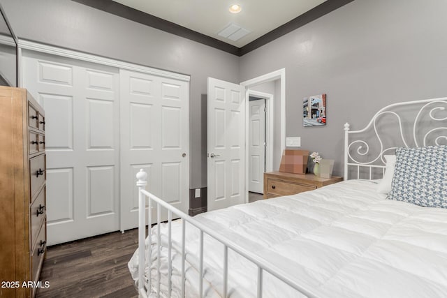 10738 W Rowel Rd, Peoria, AZ 85383 - bedroom with dark wood-style flooring and a closet