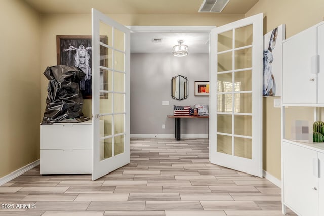 10738 W Rowel Rd, Peoria, AZ 85383 - mudroom featuring french doors, wood tiled floors, and baseboards
