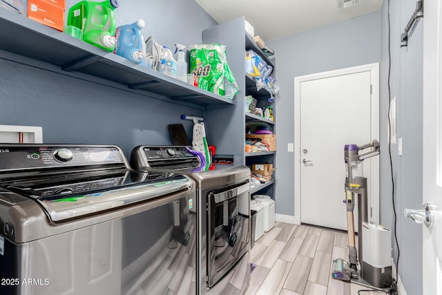 10738 W Rowel Rd, Peoria, AZ 85383 - laundry area featuring independent washer and dryer, wood finish floors, and baseboards