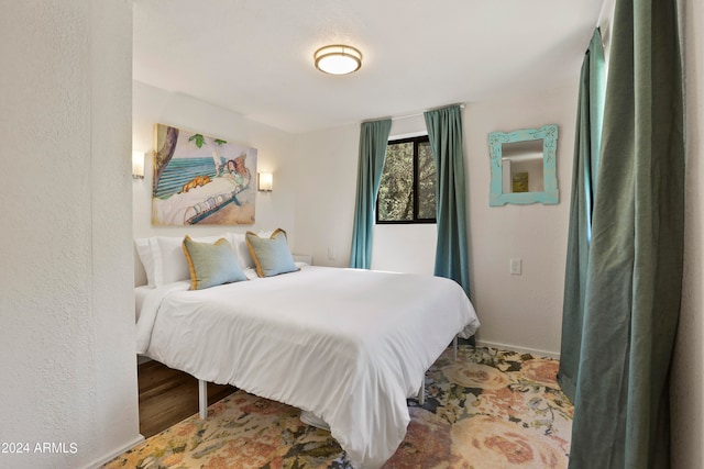 bedroom featuring hardwood / wood-style flooring