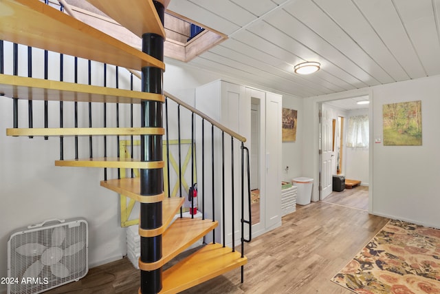 stairway featuring hardwood / wood-style flooring