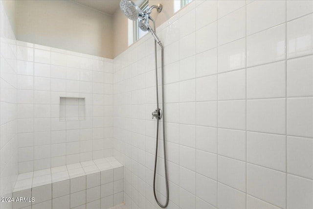 bathroom with a tile shower