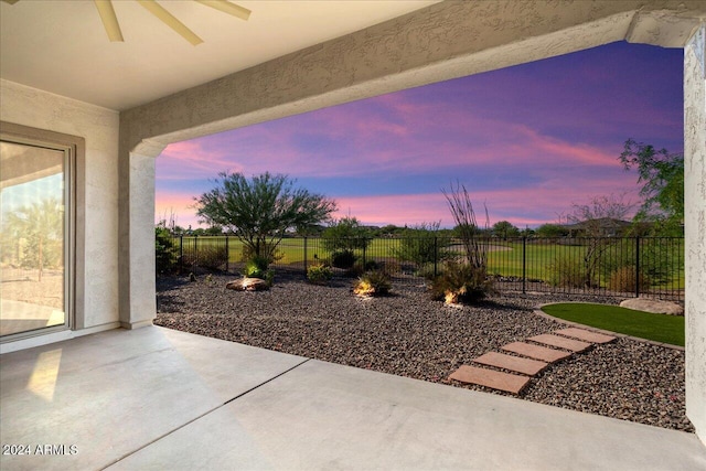 view of patio terrace at dusk