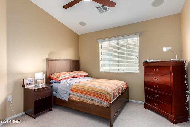 bedroom with light carpet, ceiling fan, and vaulted ceiling