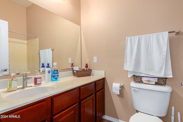 bathroom with vanity and toilet