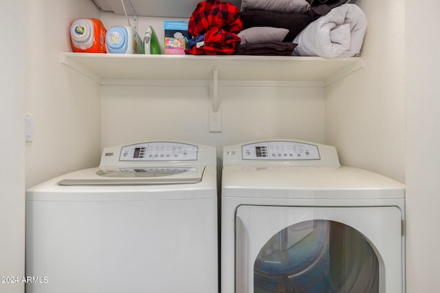 washroom with washer and dryer