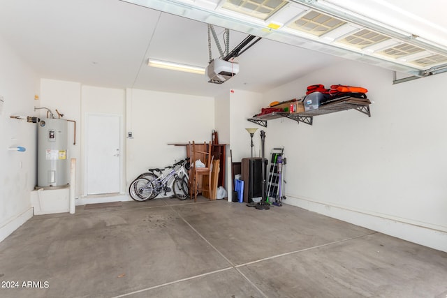 garage with electric water heater and a garage door opener