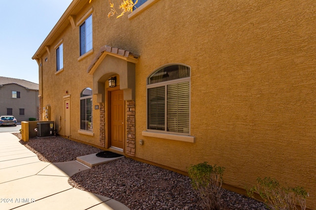 view of exterior entry with cooling unit