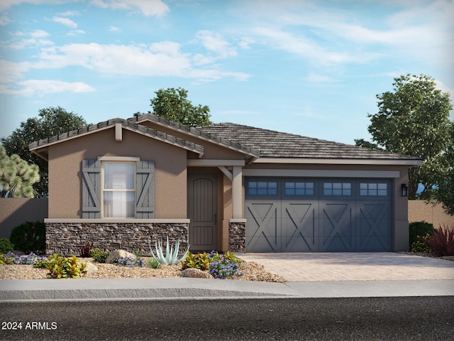 24592 W Bowker St, Buckeye, AZ 85326 - view of front facade featuring stone siding, stucco siding, a garage, and driveway