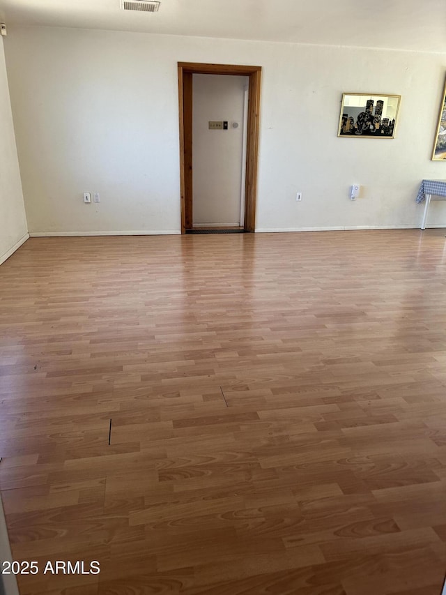 902 S Una Ave, Tempe, AZ 85281 - empty room featuring wood finished floors and baseboards