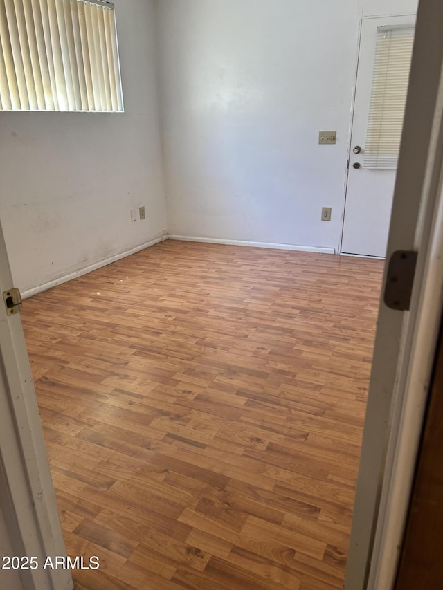 902 S Una Ave, Tempe, AZ 85281 - spare room with wood finished floors and baseboards