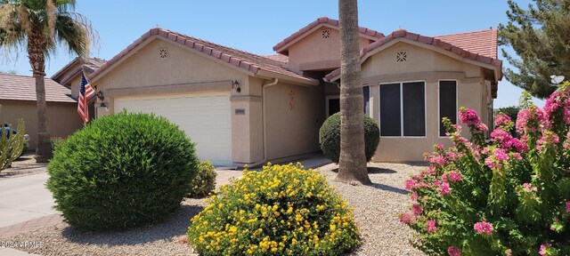 single story home featuring a garage