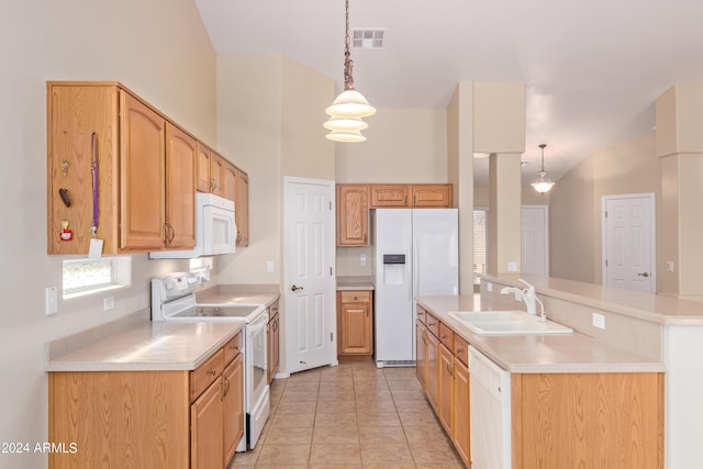 kitchen with light tile patterned flooring, a towering ceiling, decorative light fixtures, sink, and white appliances