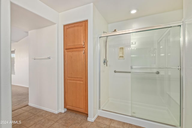 bathroom featuring tile patterned flooring and walk in shower