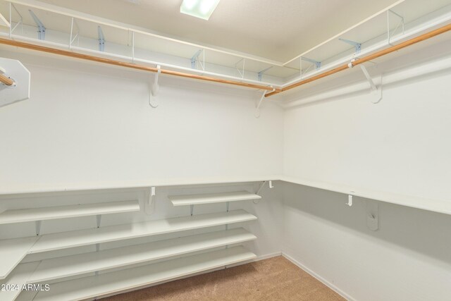 full bathroom featuring a wealth of natural light, vanity, combined bath / shower with glass door, and toilet