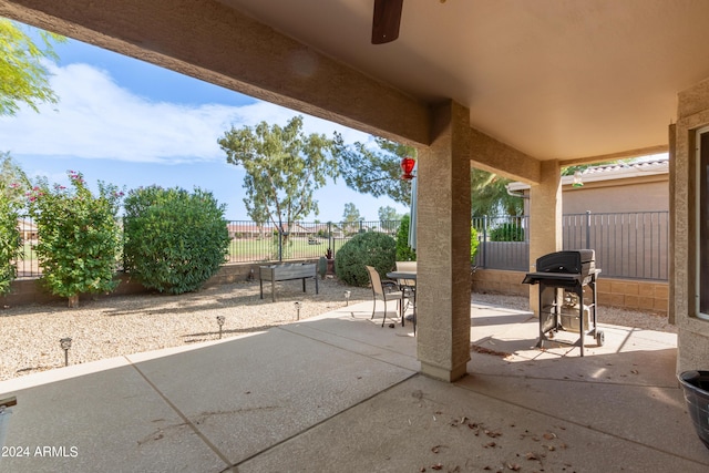 view of patio / terrace with grilling area and ceiling fan