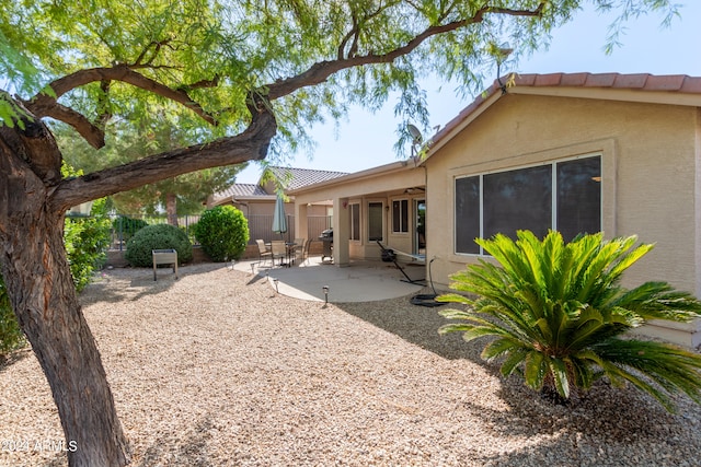 rear view of house with a patio