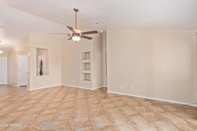 unfurnished room featuring lofted ceiling, built in shelves, and ceiling fan