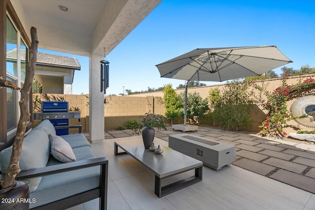 view of patio / terrace featuring an outdoor living space and a grill