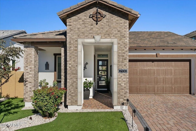 view of front facade with a front yard and a garage