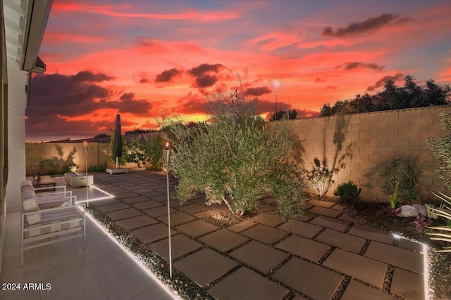 view of patio terrace at dusk