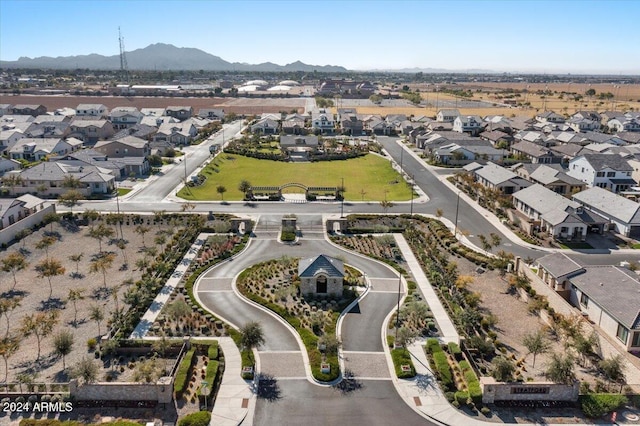 birds eye view of property with a mountain view