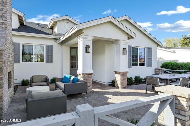 view of patio with outdoor dining area and outdoor lounge area