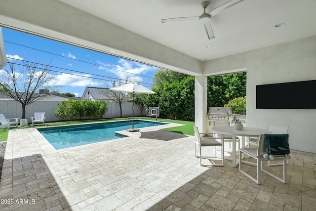 view of pool with area for grilling, a patio, a fenced backyard, a grill, and a fenced in pool