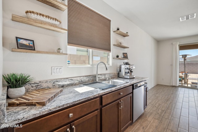 2335 W Sunland Ave, Phoenix, AZ 85041 - kitchen featuring open shelves, stainless steel dishwasher, a sink, and plenty of natural light