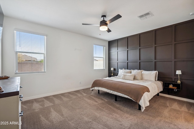 2335 W Sunland Ave, Phoenix, AZ 85041 - bedroom featuring a decorative wall, carpet, baseboards, and a ceiling fan