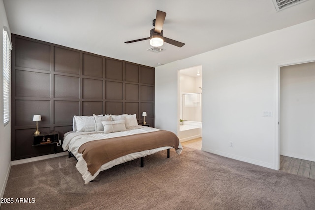 2335 W Sunland Ave, Phoenix, AZ 85041 - bedroom with a decorative wall, carpet floors, baseboards, connected bathroom, and a ceiling fan