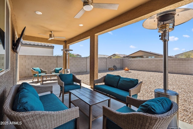 2335 W Sunland Ave, Phoenix, AZ 85041 - fenced backyard with ceiling fan, an outdoor living space, and a patio area