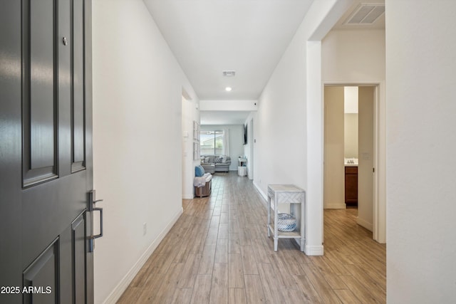 2335 W Sunland Ave, Phoenix, AZ 85041 - corridor featuring light wood-style floors, baseboards, and recessed lighting