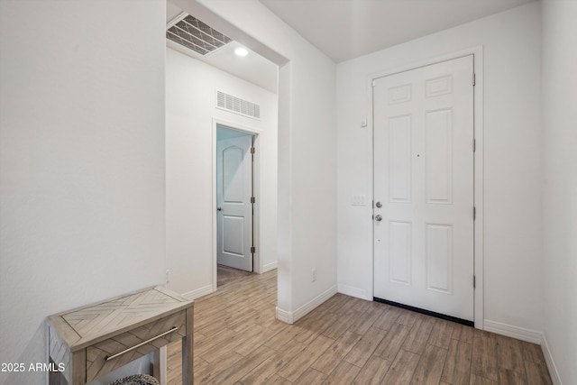 2335 W Sunland Ave, Phoenix, AZ 85041 - foyer with light wood-style flooring and baseboards