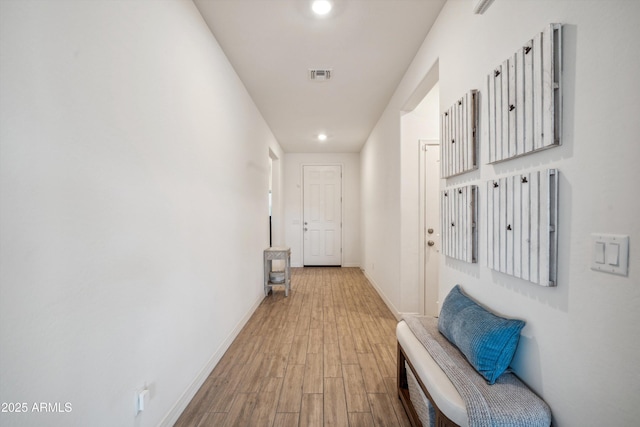 2335 W Sunland Ave, Phoenix, AZ 85041 - corridor with wood finished floors, baseboards, and recessed lighting