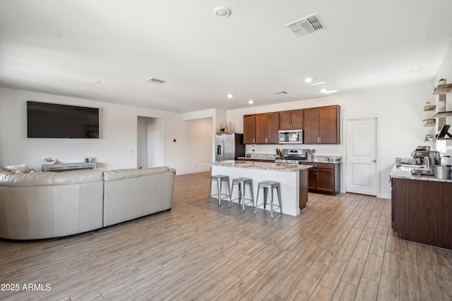 2335 W Sunland Ave, Phoenix, AZ 85041 - living area with light wood finished floors and recessed lighting