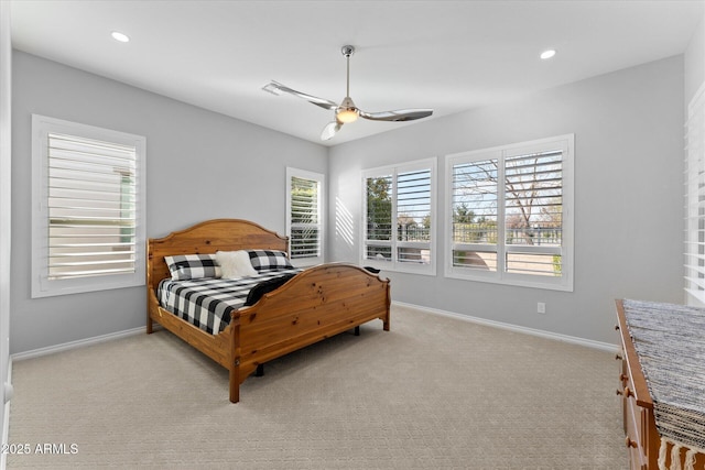 bedroom with ceiling fan and light colored carpet