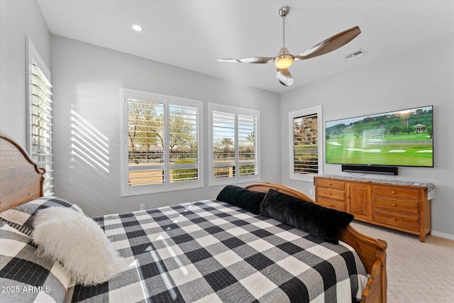 carpeted bedroom with ceiling fan