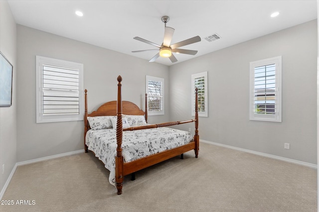 bedroom with light carpet and ceiling fan