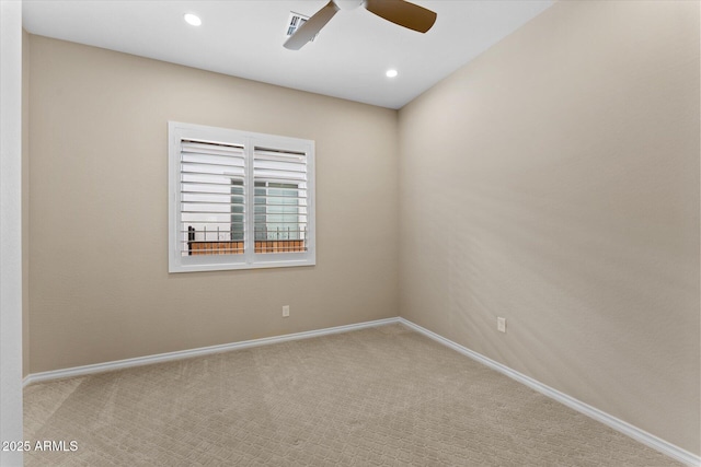 carpeted spare room with ceiling fan