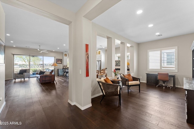 interior space featuring ceiling fan, dark hardwood / wood-style flooring, and a wealth of natural light