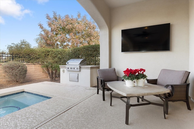 view of swimming pool with grilling area, exterior kitchen, a hot tub, and a patio