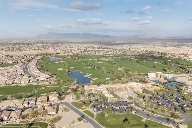 birds eye view of property with a water and mountain view