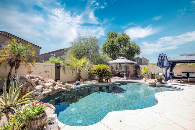 view of pool with a gazebo and a patio