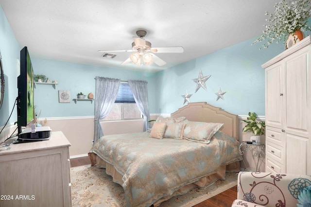 bedroom featuring light wood-type flooring and ceiling fan