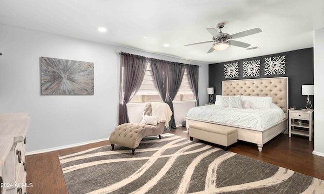 bedroom featuring ceiling fan and dark hardwood / wood-style floors