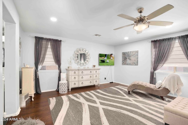 sitting room with ceiling fan and dark hardwood / wood-style floors