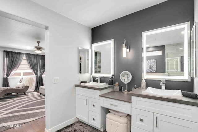 bathroom with vanity and hardwood / wood-style flooring